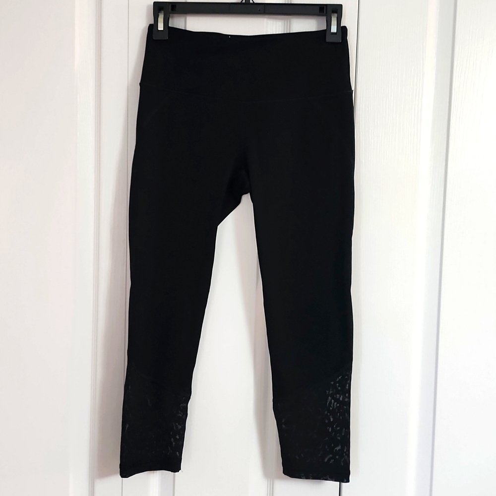 Victoria's Secret Sport black Capri leggings with sheer leopard print bottom. SM